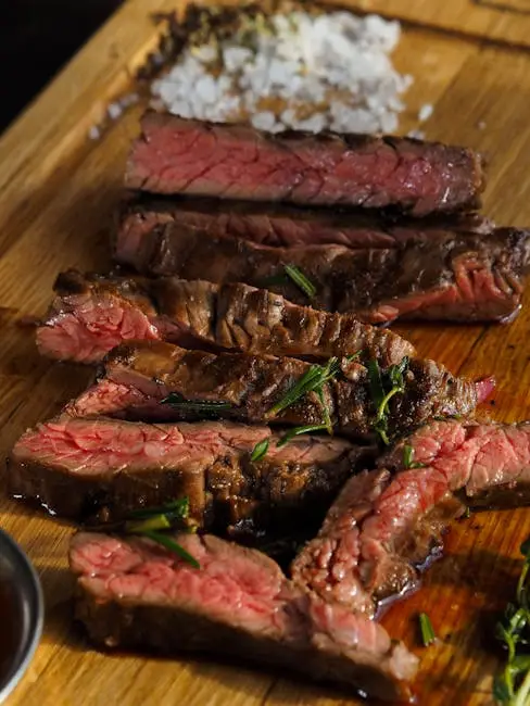 pexels-photo-8694617-8694617 Close-up of sliced grilled steak with seasoning on a wooden board, highlighting texture and juiciness.